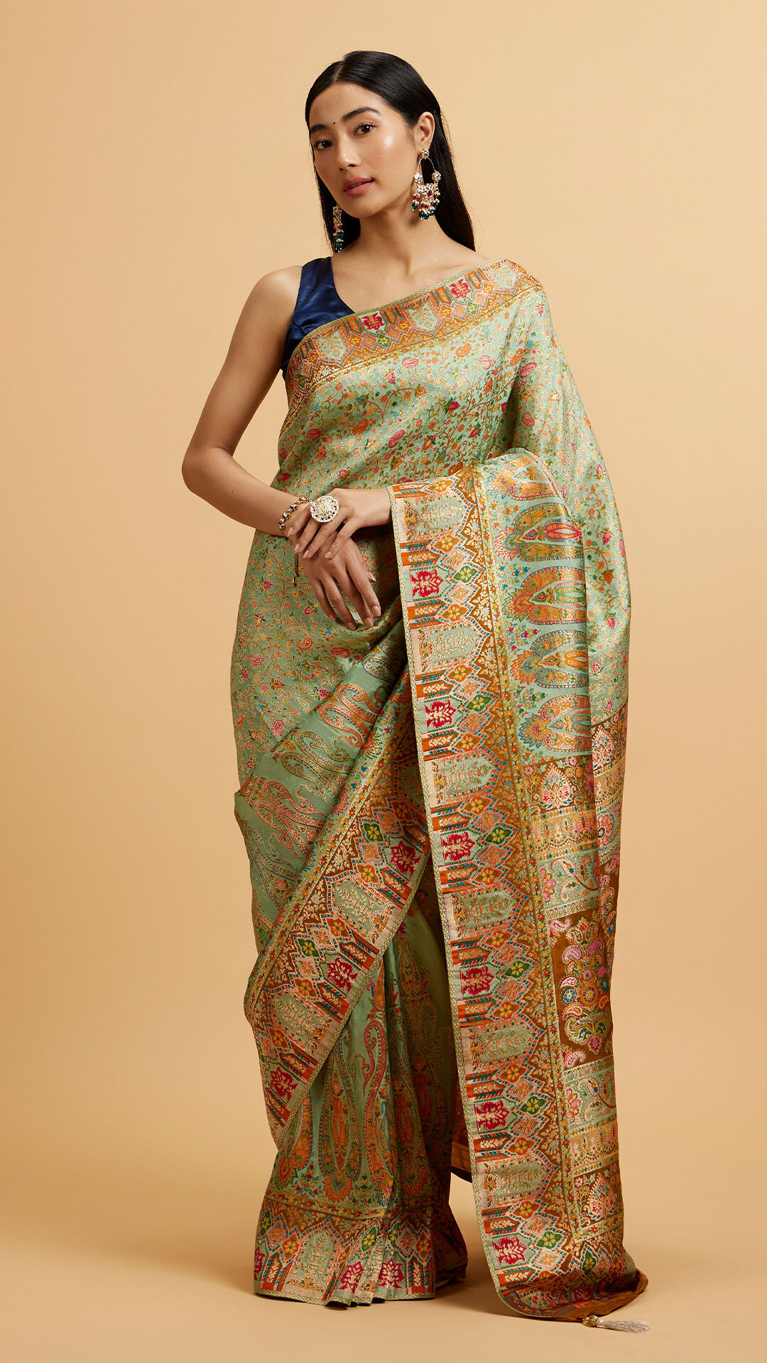 Girl wearing mehendi green small print saree styled for effortless ethnic look